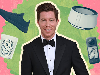 Olympic snowboarder Shaun White, the Flying Tomato, in a tuxedo surrounded by a walking shoe, a candle, a sound machine and a camera, items he packs in his carry on bag.