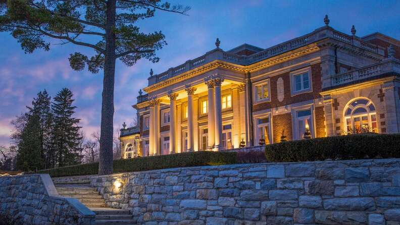 canyon ranch lenox hotel lit up beneath a dusky sky