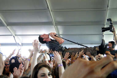 lead singer crowdsurfing at coachella music festival