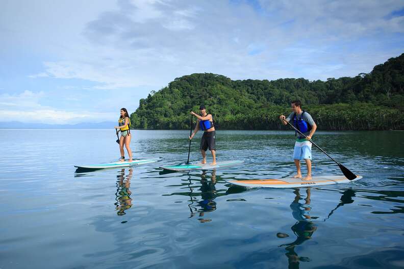 stand up paddle boarders on a lake in costa rica
