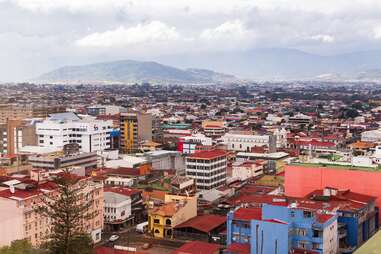 High angle view of downtown San Jose, with mountains in soft focus background