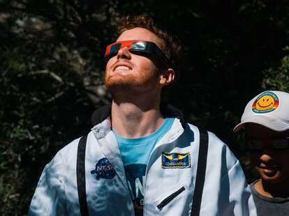 A spectator wears eye protection to view the eclipse in Texas 