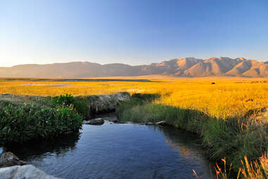 wild willy's hot springs in mammoth with a view of the mountains