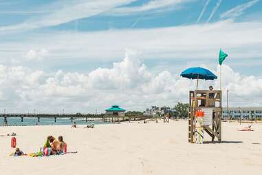 colorful umbrellas and lounge chairs on the beach in Hampton, Virginia