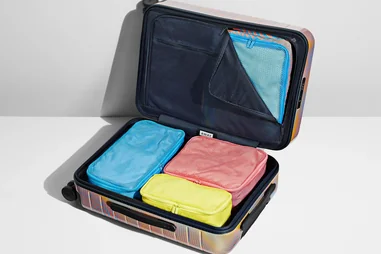The interior of the Soundwave Luggage Collection suitcase from Away, with packing cubes.