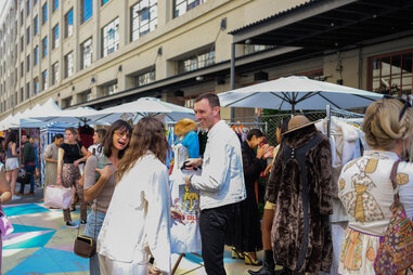 people shopping at a vintage fair outdoors at ROW DTLA in the arts district of LA