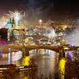 New Years Eve in Prague at night with the view on Charles Bridge and historic center.