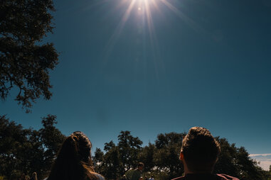 Spectators during a solar eclipse in Driftwood, Texas, US, on Saturday, Oct. 14, 2023.