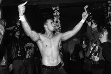 villain wrestler gives the crowd a middle finger at bar wrestling in la