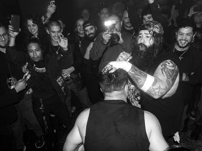 casanova valentine loads up a punch at barroom blitz bar wrestling in la