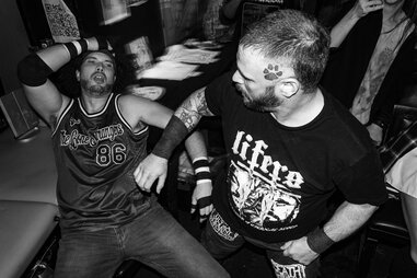 two wrestlers in a bar fight at barroom blitz bar wrestling in LA