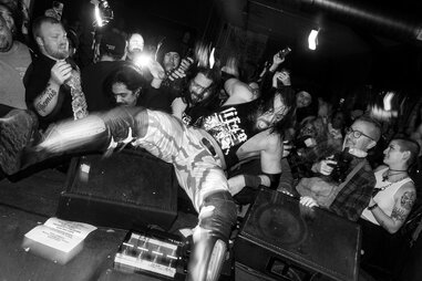 wrestler crashing over speakers at bar wrestling in los angeles