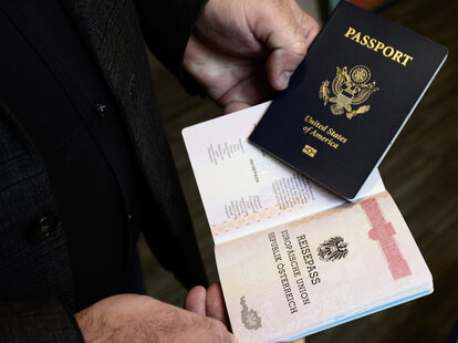 Man holding his USA and Germany passports