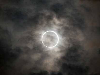 The sun is obscured by the moon during an annular solar eclipse in Tokyo, Japan