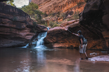 fly fishing in utah small space mill creek in canyon with waterfall