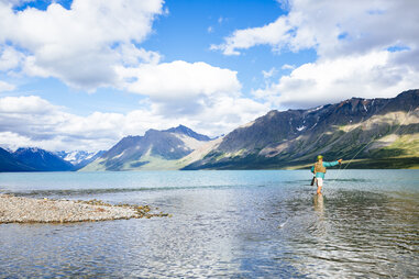 twin lake, fly fisherman, mountains, close to shore