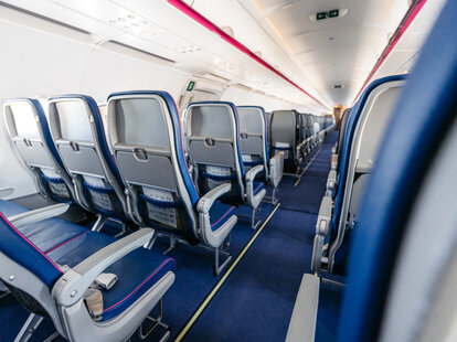 Empty airplane seats cushion thickness