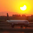 plane with eclipse background