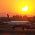 plane with eclipse background