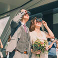 couple at wedding with eclipse glasses
