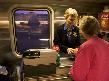 A woman buys snacks in the cafe car March 17, 2005 aboard train 1. Food available in the dining car is pleasant, if expensive