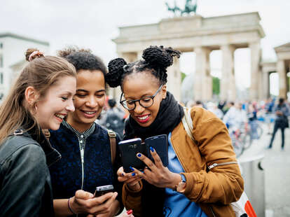A group of friends travelling together are exploring the local attractions in Berlin
