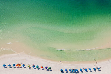 Beach umbrellas on beach, Destin, Florida, USA