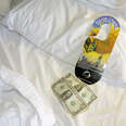 A tip for housekeeping on a bed in the Crowne Plaza Jacksonville Riverfront hotel.