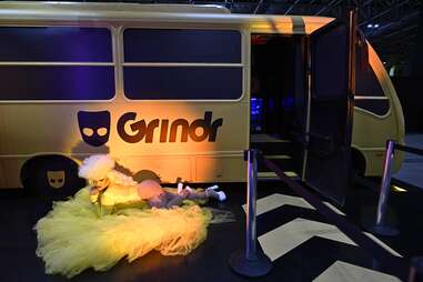 A drag queen performs at the stand of the US social networking application Grindr during the Web Summit Rio 2024