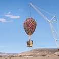 The Airbnb Up House, which is being suspended in the air by a crane. The house even features the balloons.