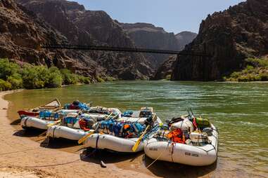 rafts with supplies on the bank of a river