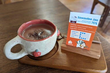 Khom’s Sawasdee Jao drinking chocolate on a table