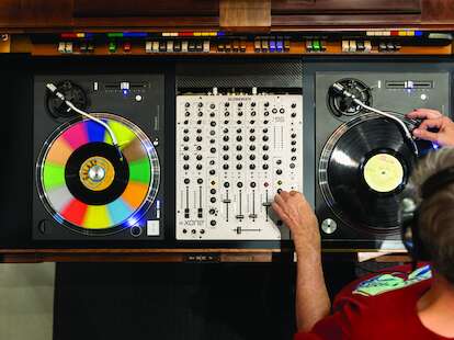 A DJ setup with two turntables seen from above 