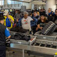 Passengers go through security check by TSA at Los Angeles International Airport on Wednesday, Jan. 10, 2024 in Los Angeles, California.