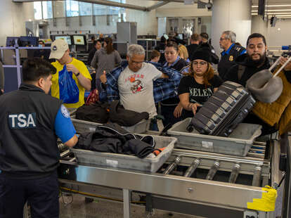 Passengers go through security check by TSA at Los Angeles International Airport on Wednesday, Jan. 10, 2024 in Los Angeles, California.