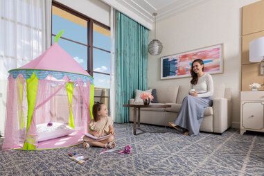 A young child and mother in a hotel room at Four Seasons Orlando.