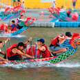 Taiepei, Taiwan, 03, June, 2022: A competitive boat racing tournament in the Dragon Boat Festival on Keelung River, where athletes pull powerfully on the oars and compete vigorously in colorful boats