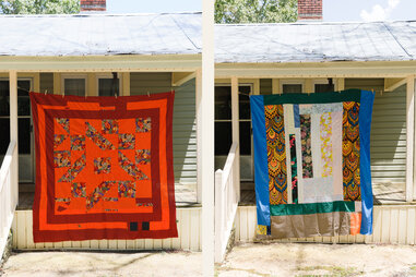colorful quilts on display in front of home in gee’s bend alabama