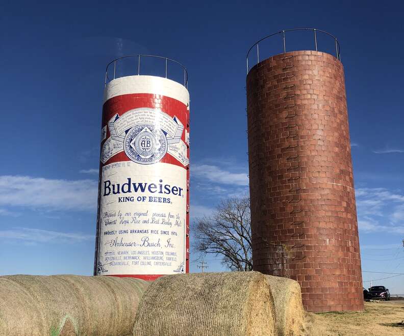 a grain silo painted like a giant Budweiser can 
