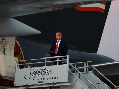 trump boarding his private jet