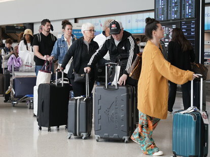 Passengers check in at San Francisco International Airport on May 24, 2024 in San Francisco, California