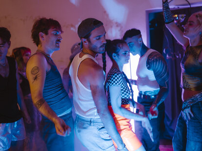 Group of friends clubbing at nightclub