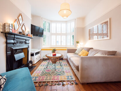 interior shot of living room with an awkwardly hung television