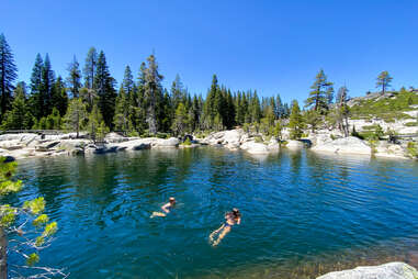 A family plays in pools and waterfalls of the Rubicon River in the Desolation Wilderness near Lake Tahoe in Placer County, California.