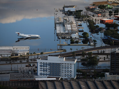 An aerial view shows the flooded tarmac of Salgado Filho International Airport in the city of Porto Alegre, Rio Grande do Sul state, Brazil, on May 20, 2024. More than 600,000 people have been displaced by the heavy rain, flooding and mudslides.