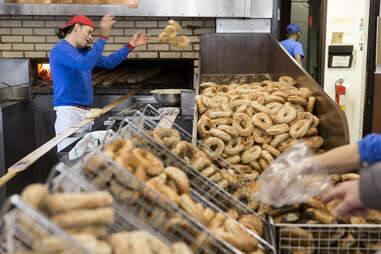 A man working at St-Viateur Bagel,a famous Montreal-style bagel bakery located in the neighbourhood of Mile End