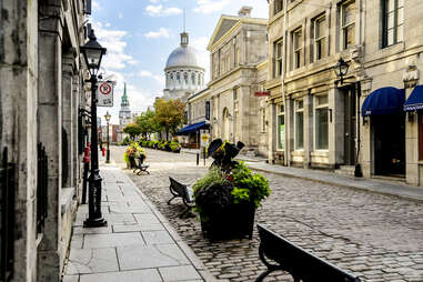 an empty cobblestone  district of old montreal