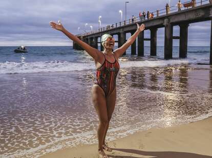 mayra santos female swimmer outstretched arms