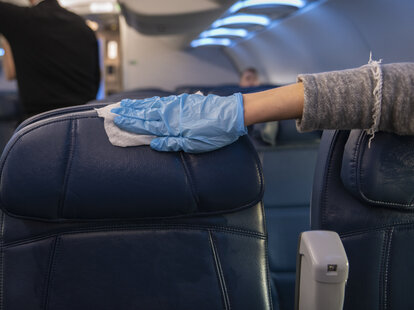 disinfecting a plane seat’s headrest