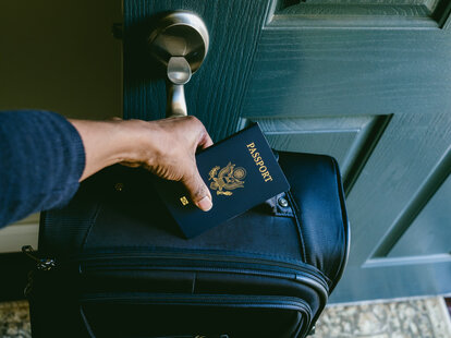 woman holding us passport
